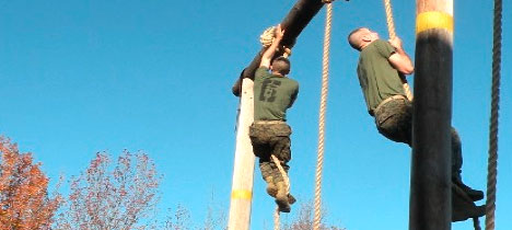Officer Candidates climb the ropes at Marine OCS